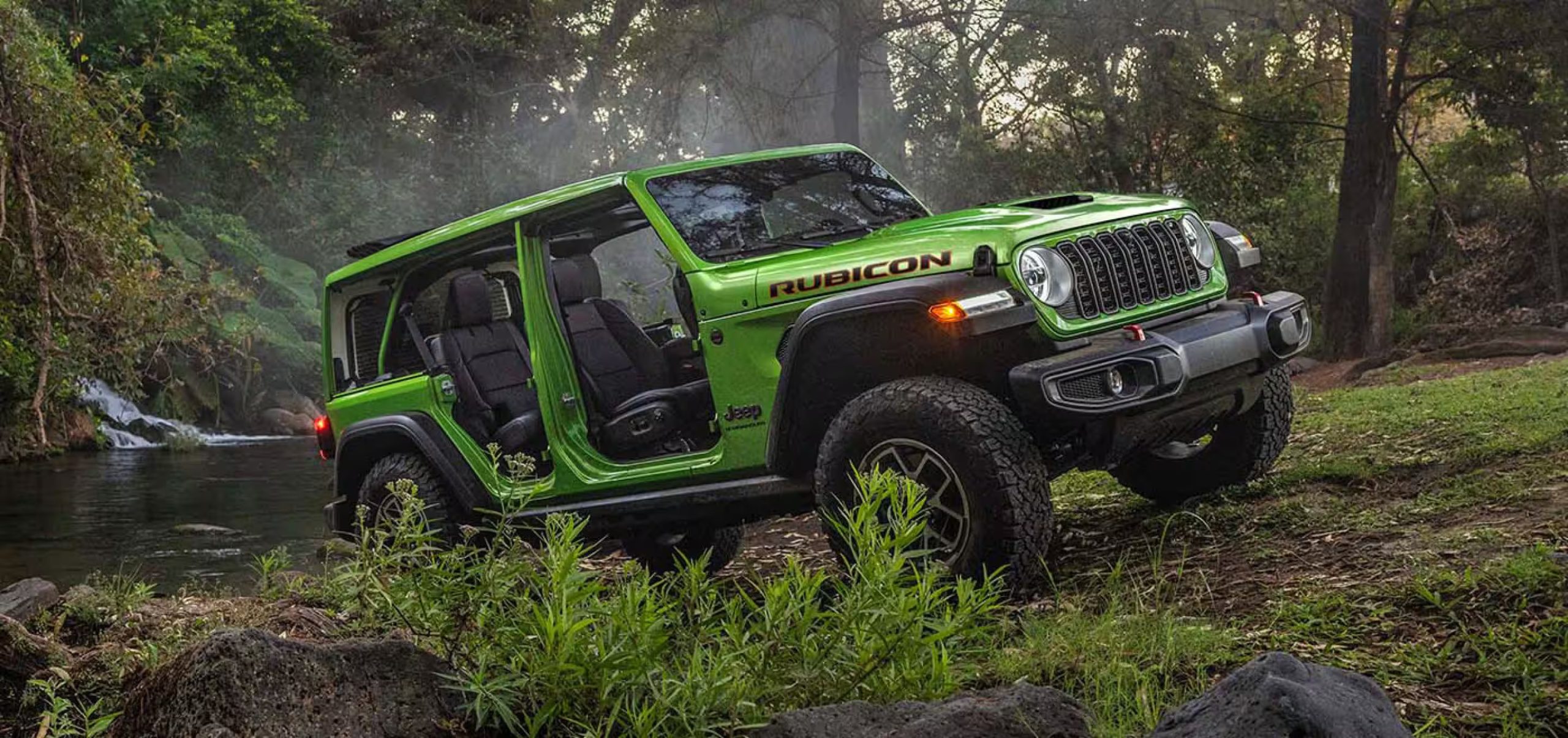 A lime green Jeep Wrangler with its doors off driving through a swampy area