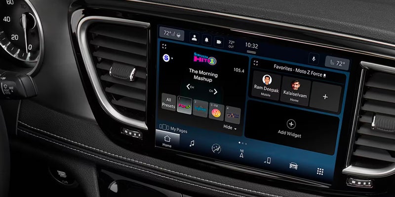 Close-up of the Chrysler Pacifica dashboard touchscreen displaying entertainment, navigation, and vehicle control features.