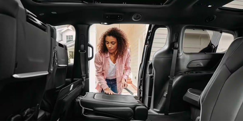 Interior view of a Chrysler Pacifica with a second-row seat folded forward, demonstrating easy access