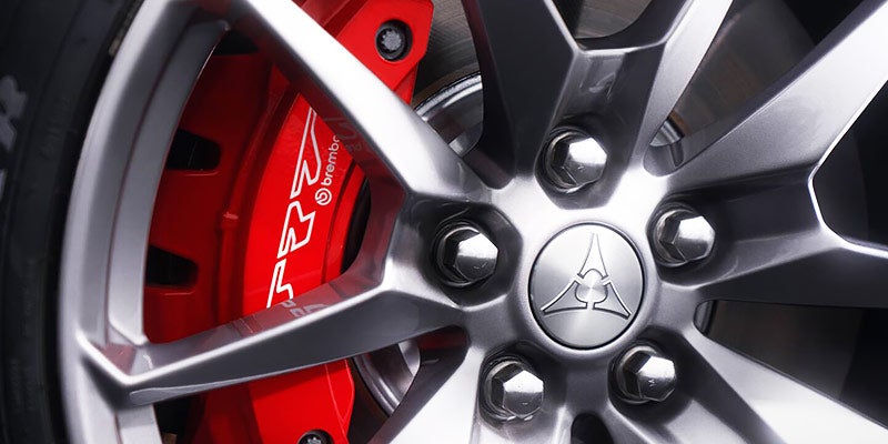 Close-up of a Dodge Charger Daytona alloy wheel with a red Brembo SRT brake caliper visible behind the spokes