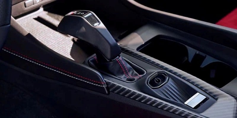 Close-up of the Dodge Charger Daytona center console featuring an electronic gear selector, drive controls