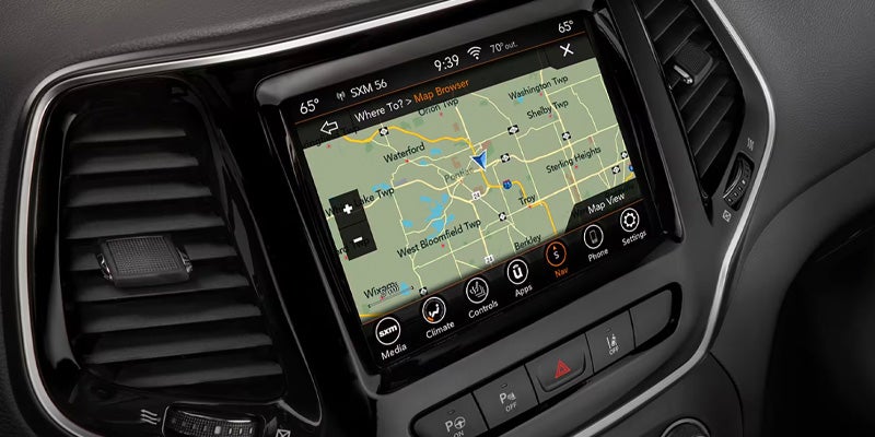 Jeep Cherokee infotainment touchscreen displaying a navigation map with nearby roads