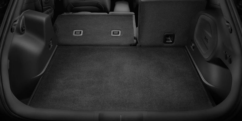 Open cargo area of a Jeep Cherokee with the rear seats folded down to create additional storage space.