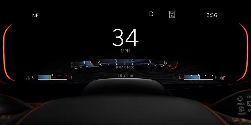 Digital dashboard displaying 34 MPH, D gear, 45 speed limit, 2:36 PM, 1963 miles, and a full tank.