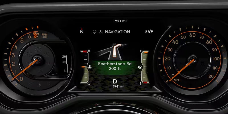 Digital car dashboard showing navigation to Featherstone Road, 200 ft away, with gauges for RPM, speed, fuel, and engine temperature.
